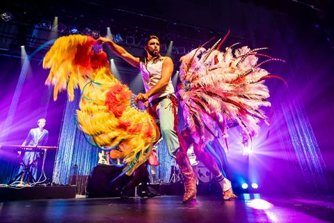 Performer at Briefs Bite Club with feathers 
